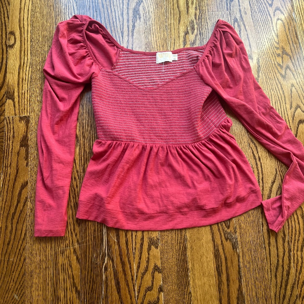 Nation, red long sleeve tea with flutter at bottom size small
